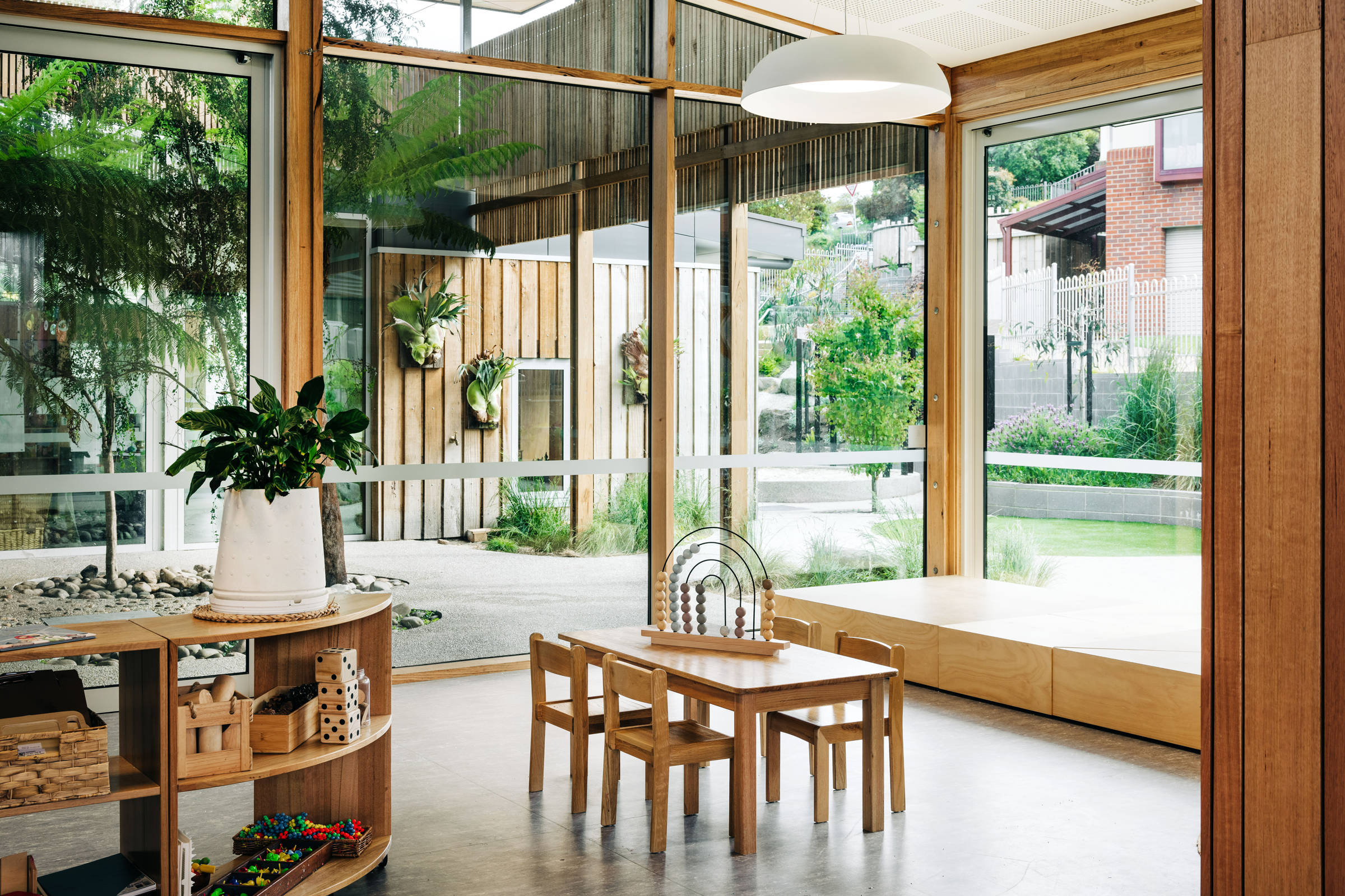 St Cuthbert’s Early Years – Catholic Education Tasmania: Layered, transparent spaces blur the boundary between inside and outside extending and connecting learning areas with easy visual observation. Photo by Adam Gibson. Photo by Adam Gibson.