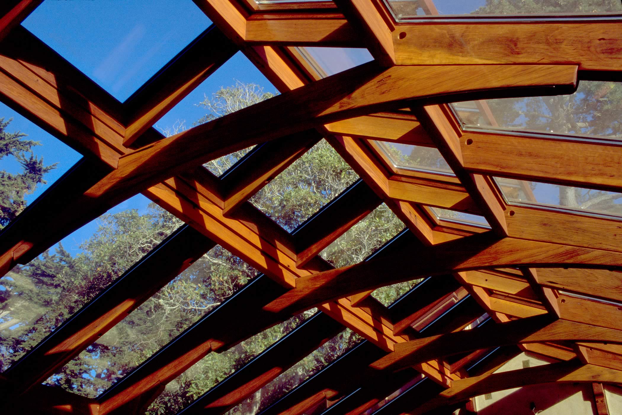 The James house Greenhouse, Carmel Highlands, California: The greenhouse detail shows opening glazed ridge vents for natural ventilation and recycled eucalyptus hardwood timber trusses (photographed during construction). Photo by James Morrison.