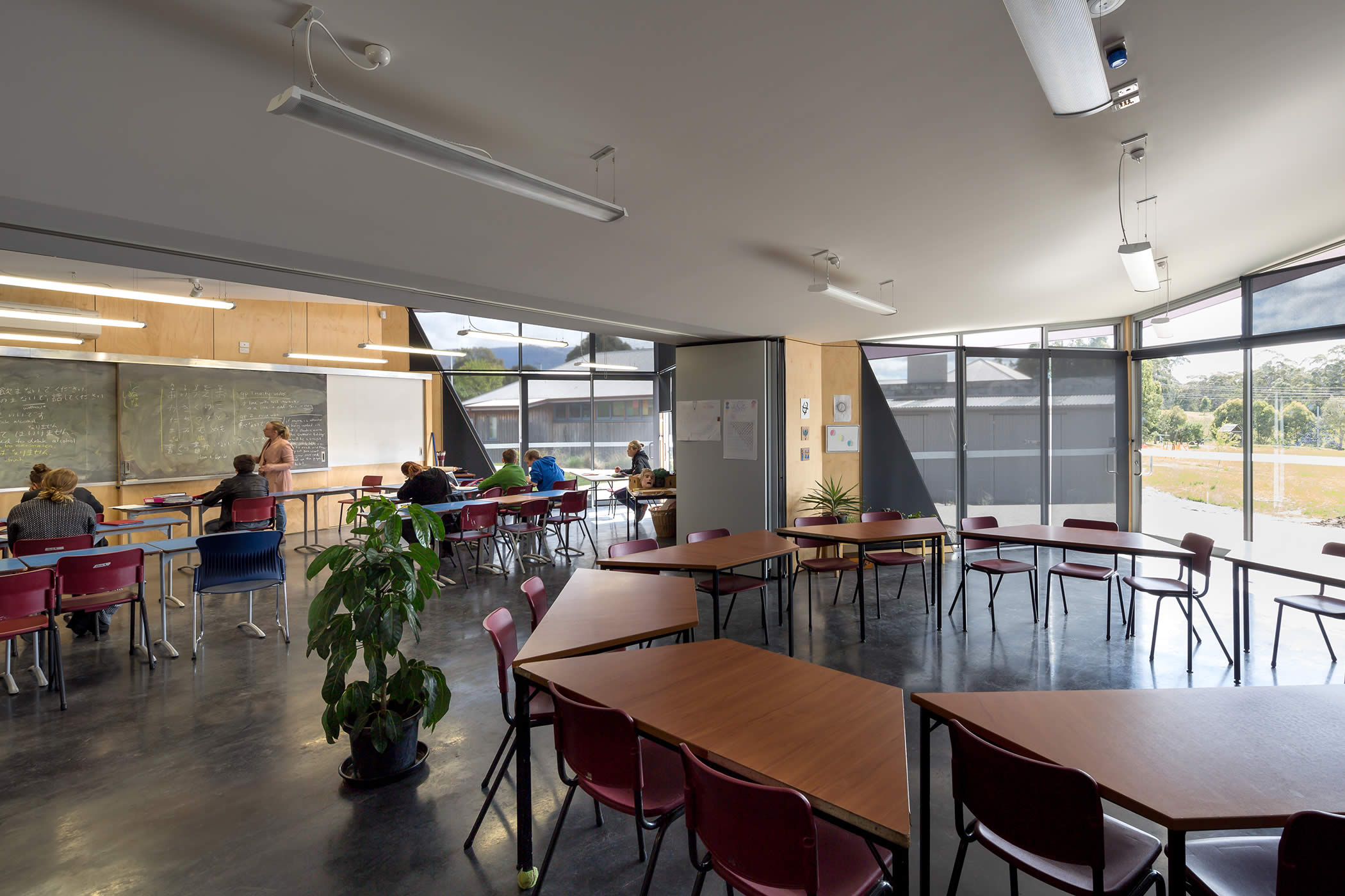 Tarremah Steiner High, Kingston, Tasmania: An internal acoustically rated operable wall links or separates adjacent learning spaces allowing flexible use and varied furniture layout supported by space efficient storage.   Photo by Thomas Ryan.